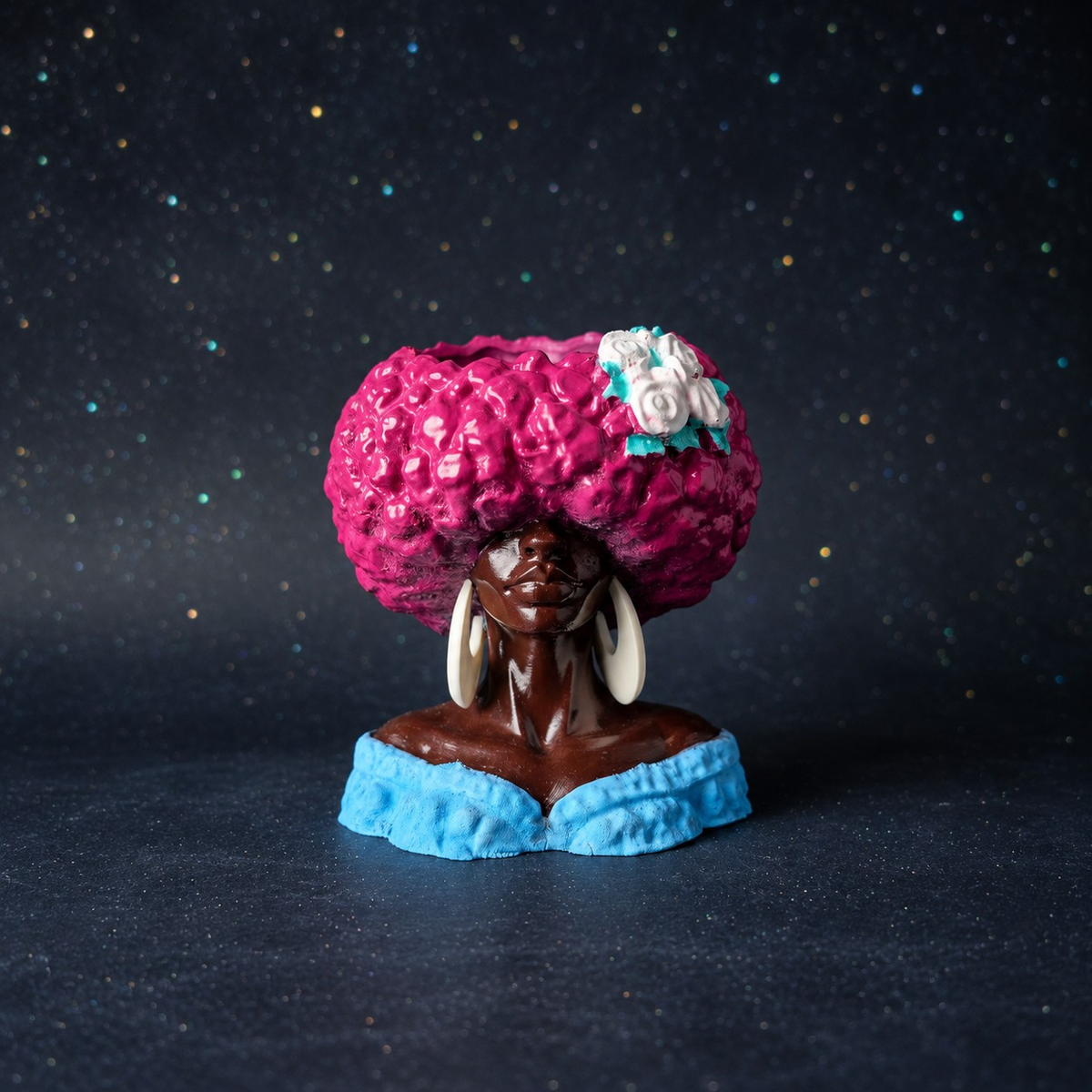 Unplanted Girl Juice head planter shown front-on against a dark studio backdrop