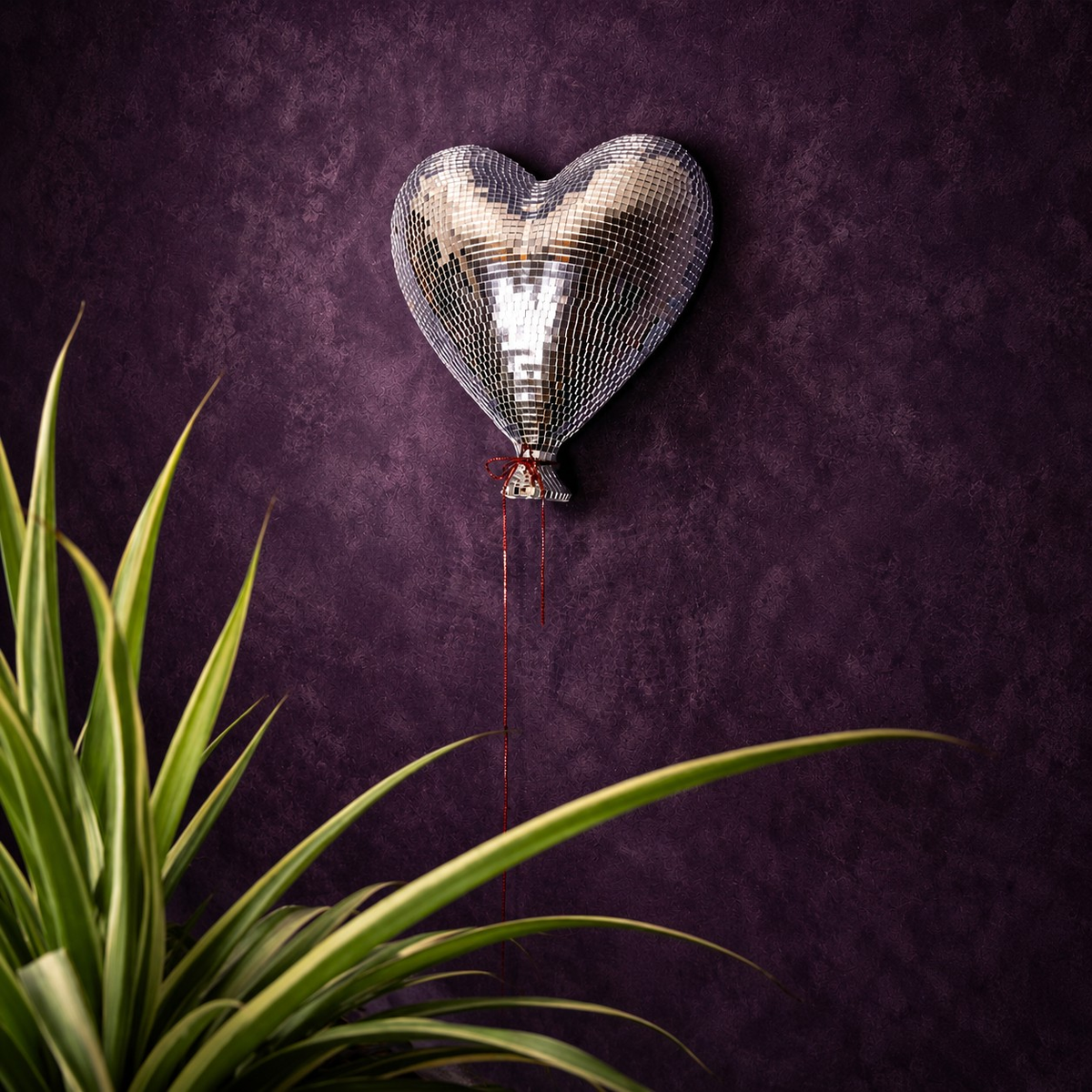 Heartthrob mirror ball heart wall art lifestyle with plant