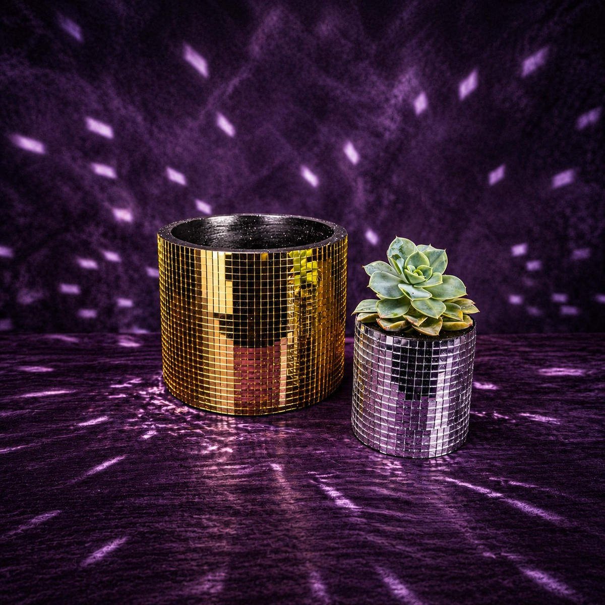 Large gold and small silver mirror-tile plant pots shown together