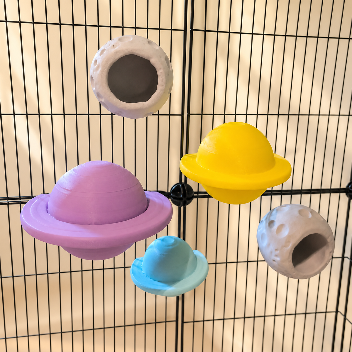 Elevated view of all three planet perches and two moon cups mounted on cage bars