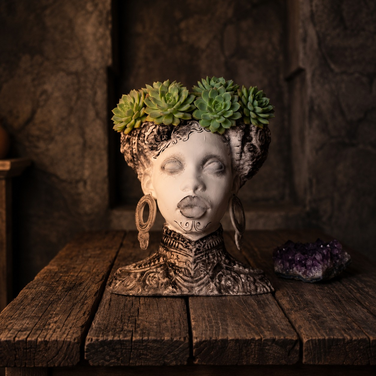 Gothic twin bowl head planter filled with green succulents on a rustic table