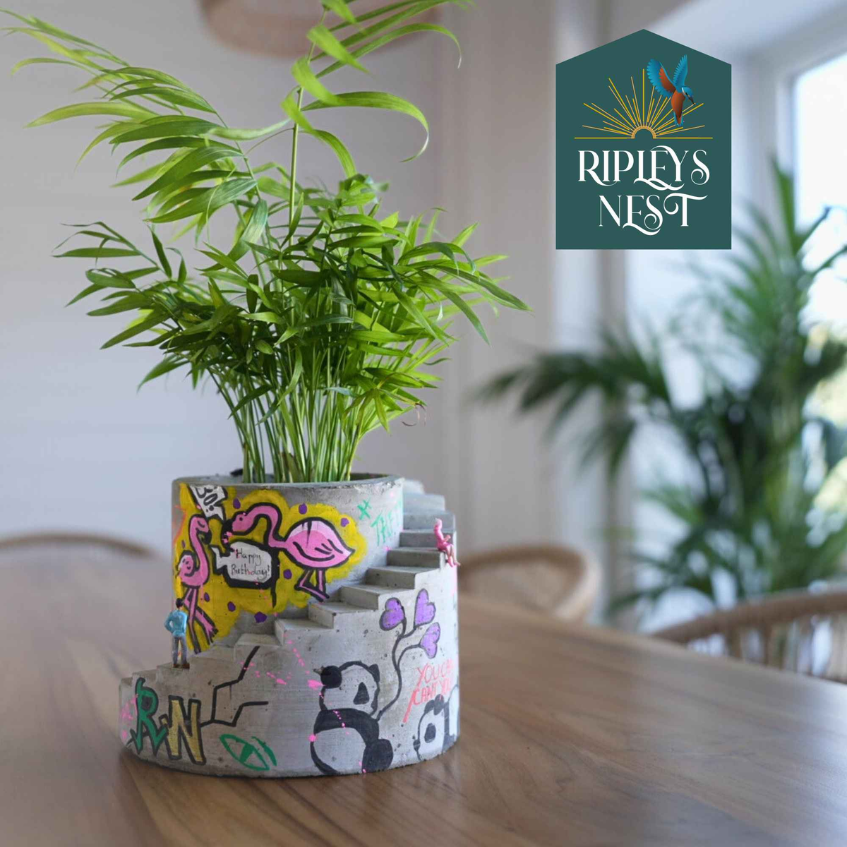 Planted custom graffiti stairwell planter with pink flamingo artwork