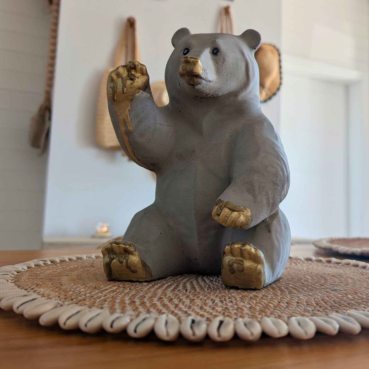 Honey bear garden ornament shown front-on in a home setting