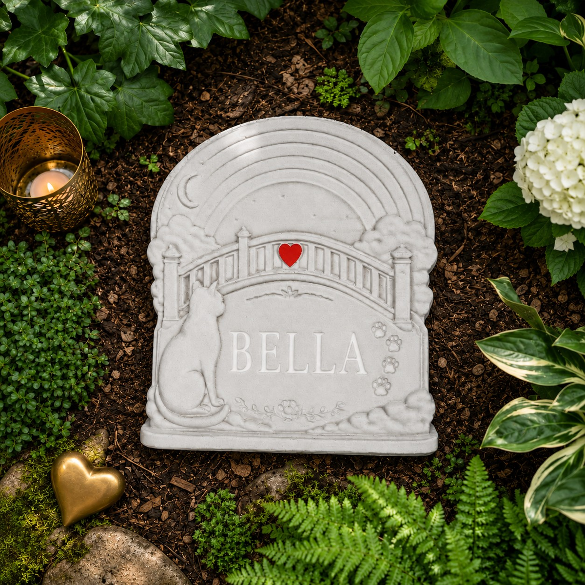 Personalised Rainbow Bridge cat grave marker shown from above among green plants