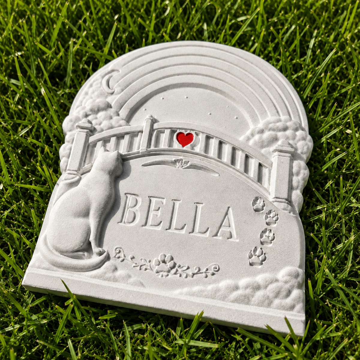 Close up of personalised Rainbow Bridge cat grave marker with name and heart detail