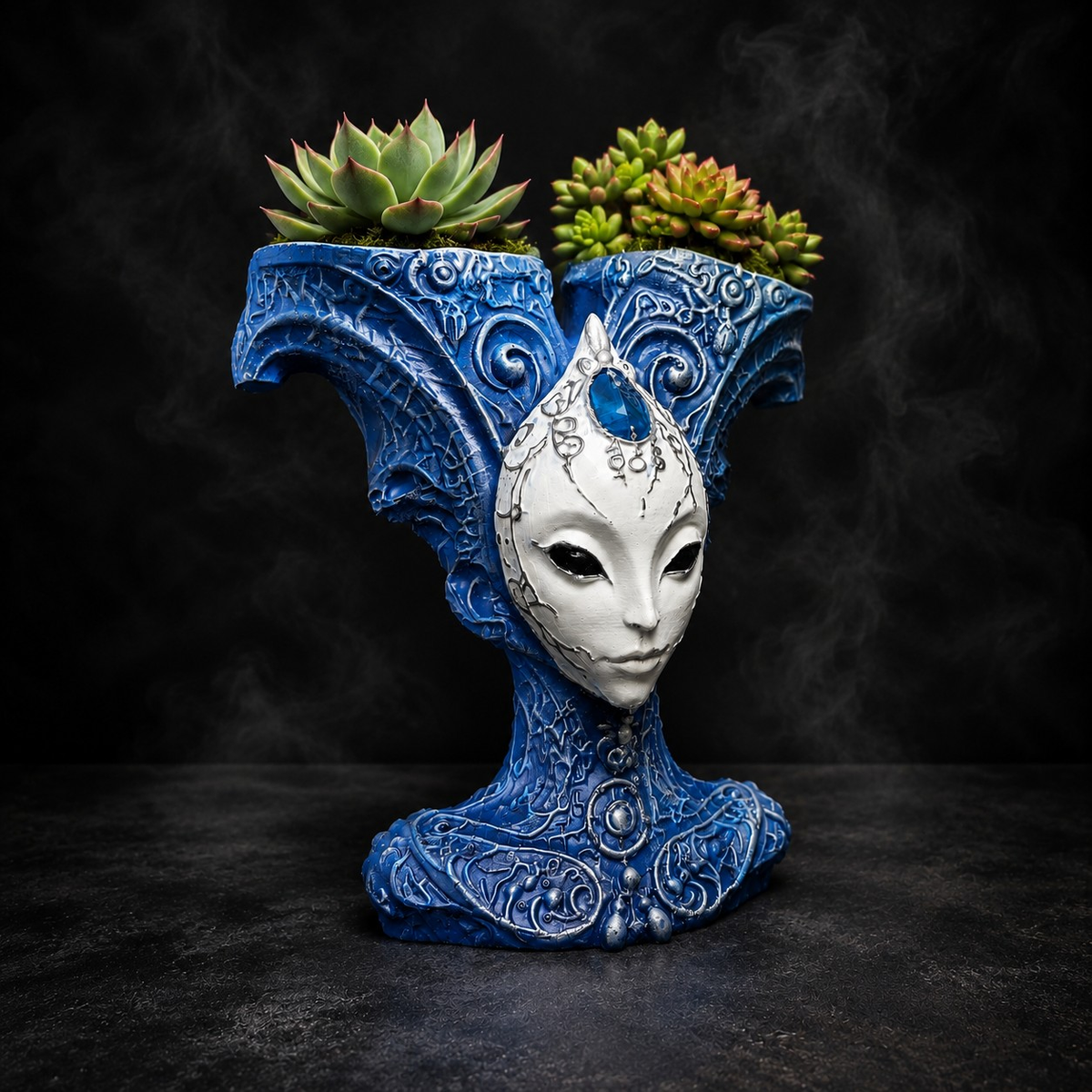 The Blue Trickster alien planter styled with succulents