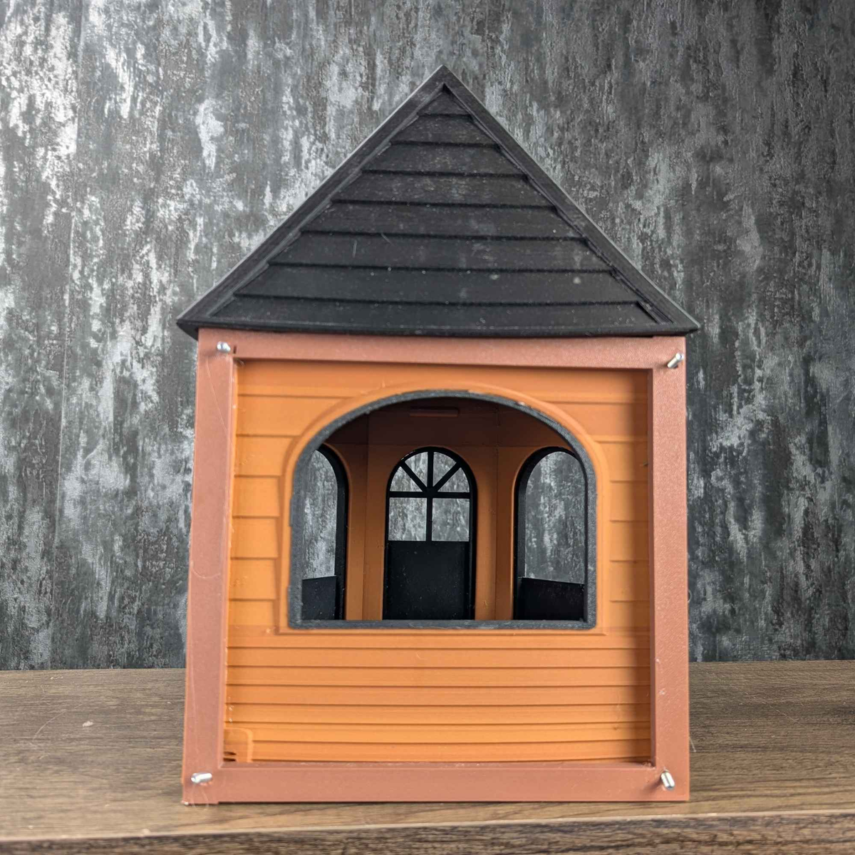 Rear opening and arched windows of the empty Rat Mansion hide