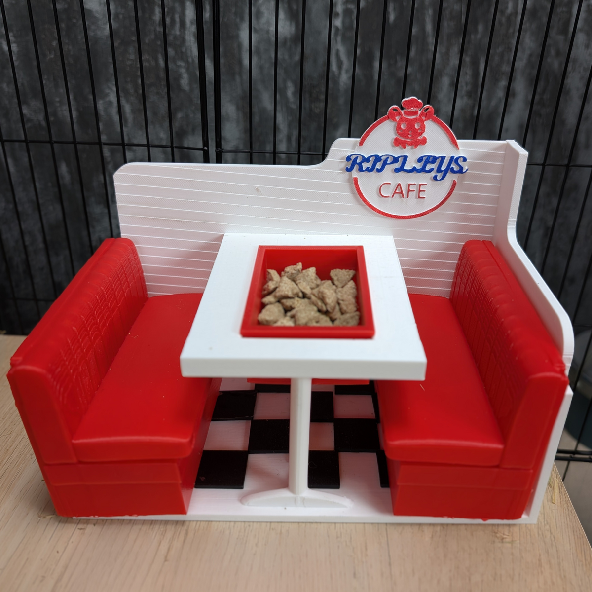 Personalised Rat Diner Feeder: Front view of the diner feeder with a checkerboard floor