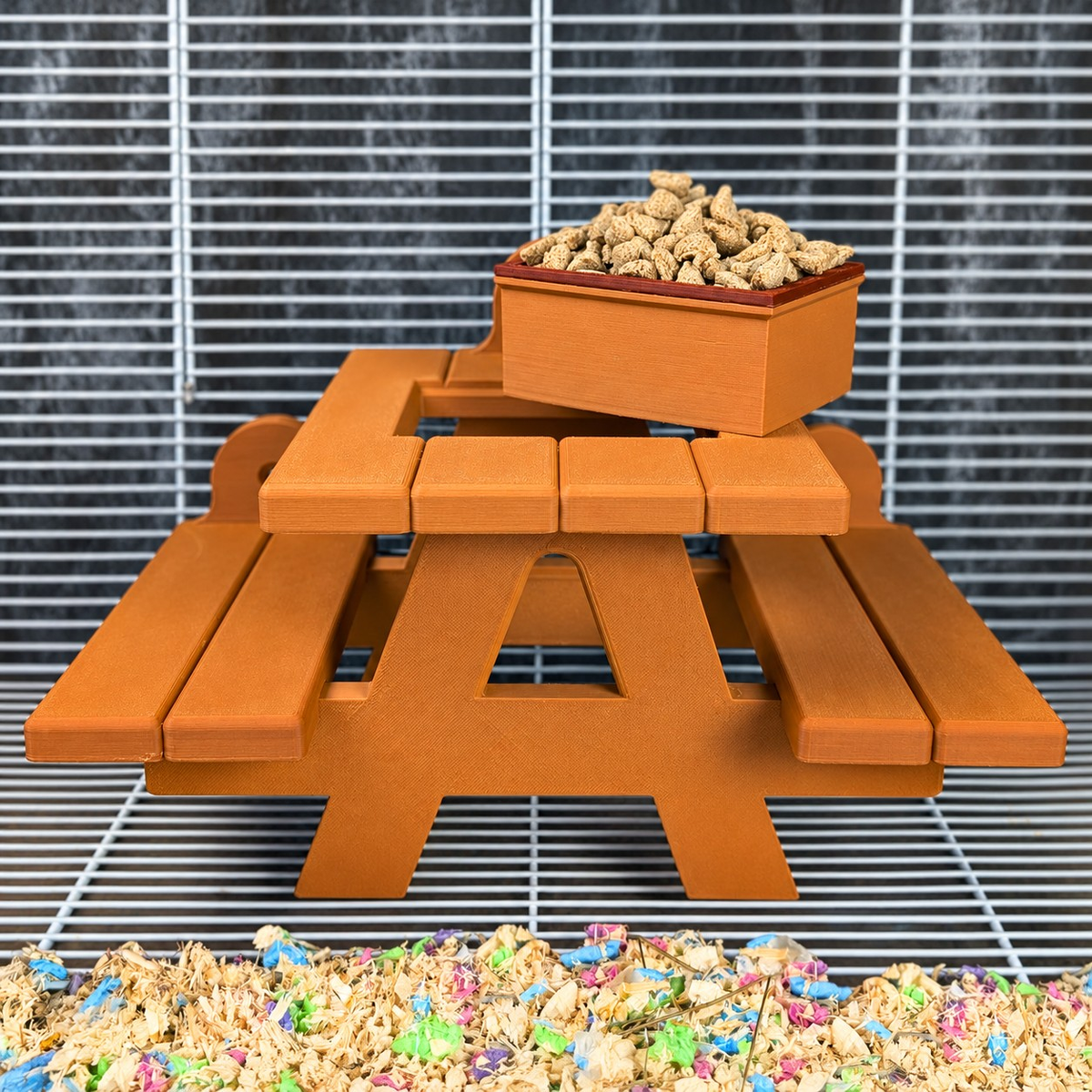 Front view of the rat picnic bench food bowl attached to cage bars