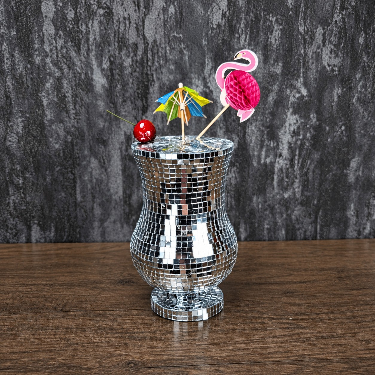 Silver mirror Pina Colada glass with colourful tropical garnish