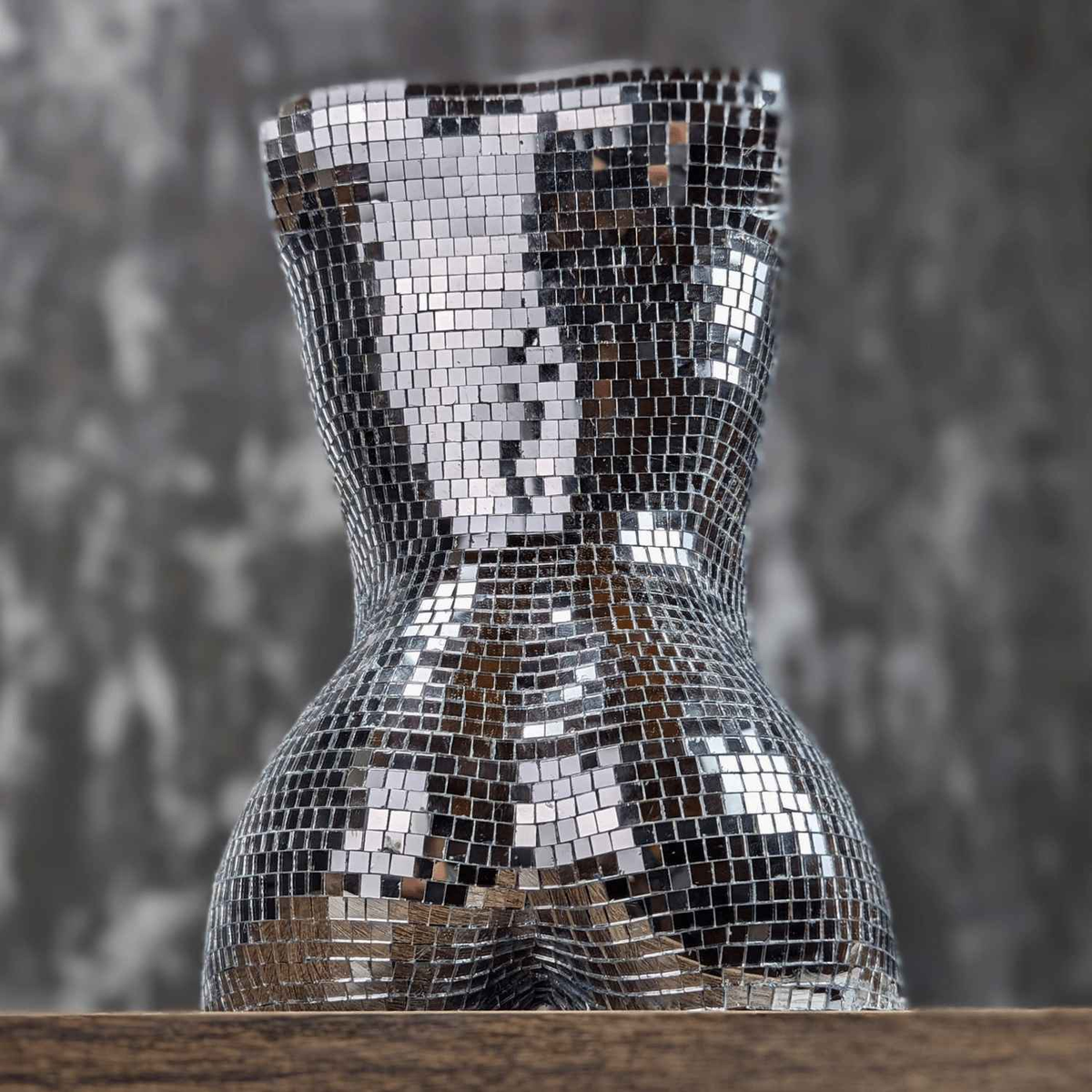 Unplanted silver mirror torso planter, rear studio view