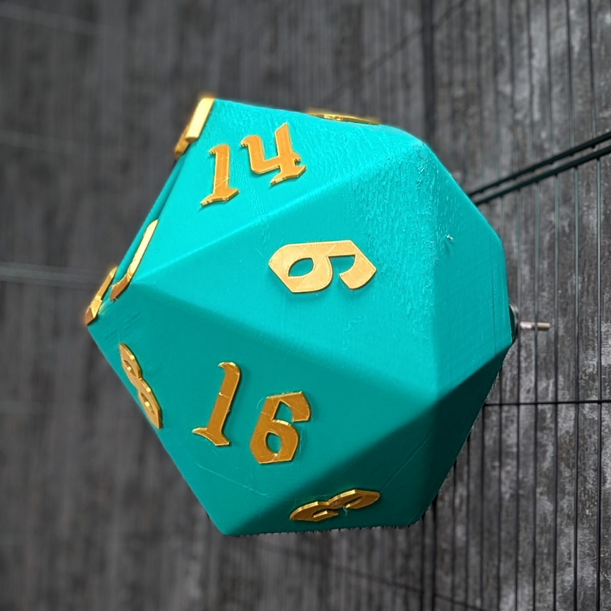 D20 Dice Rat Hide: close-up of numbered teal faces and raised numerals