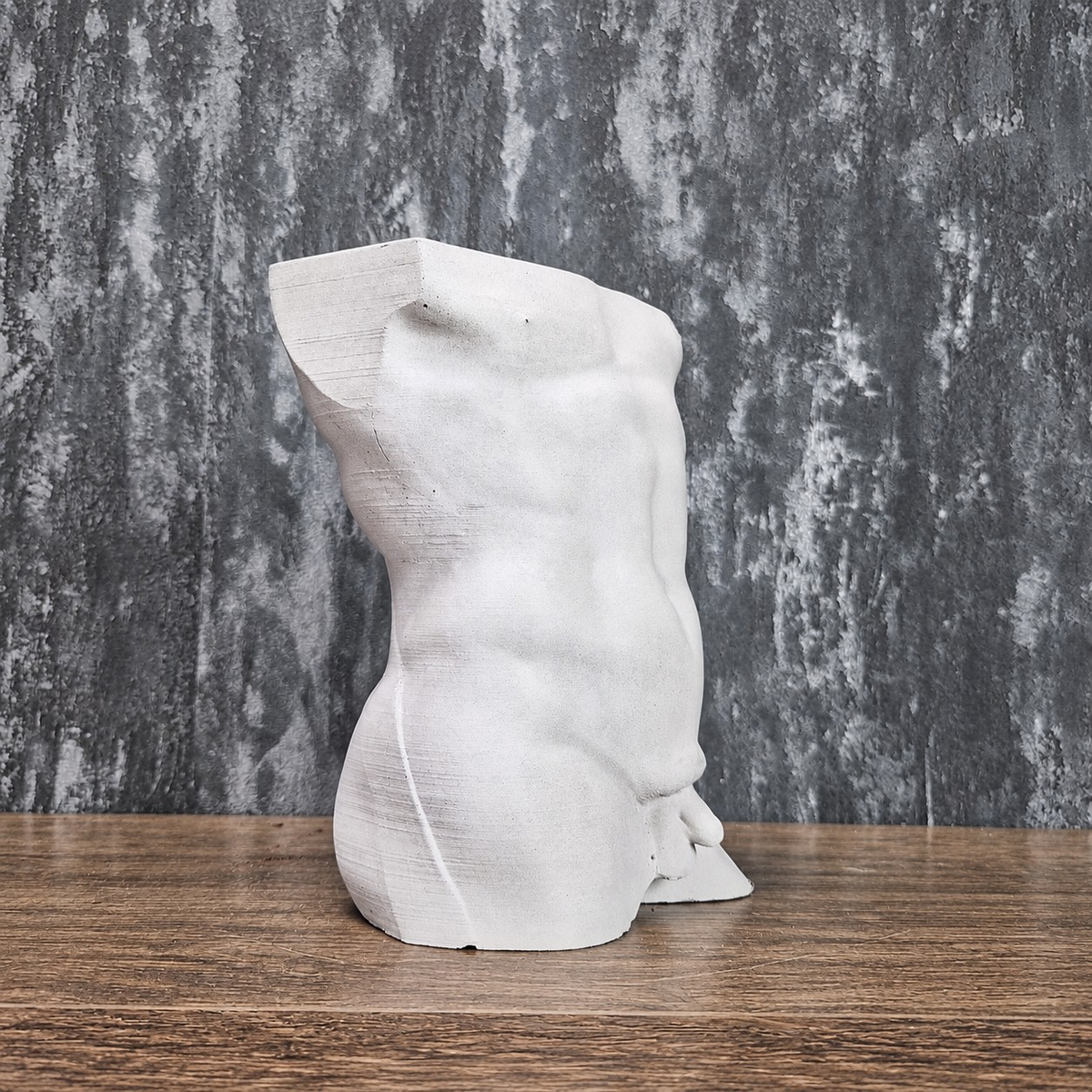 Side profile of unplanted Greek god male torso planter