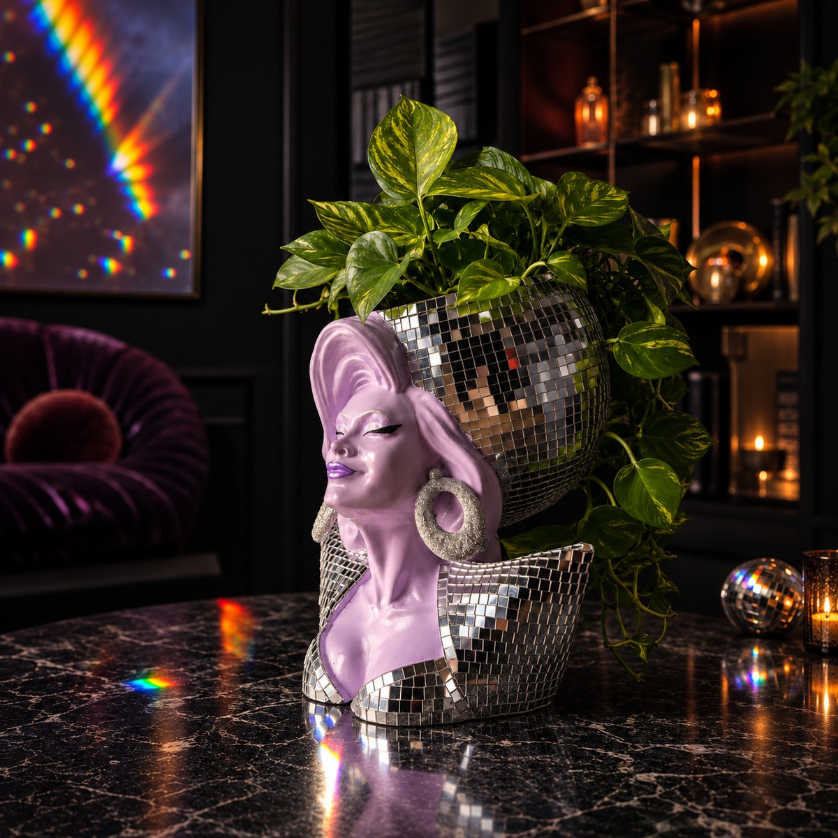 Side lifestyle view of Mother Mirrorball with green houseplant