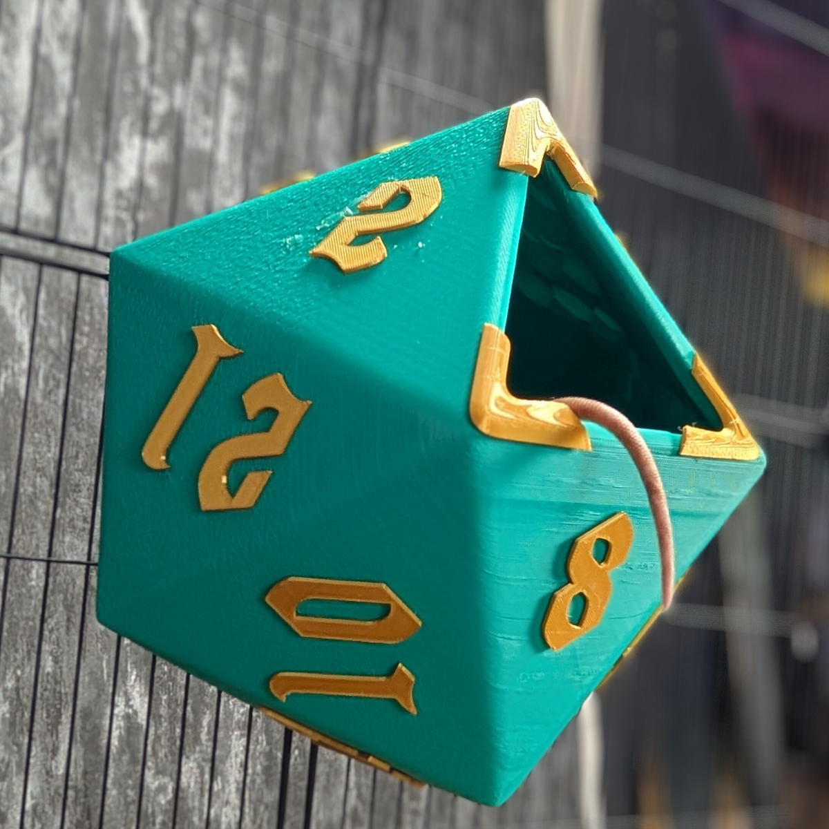 D20 Dice Rat Hide: side view of the triangular opening and raised numerals