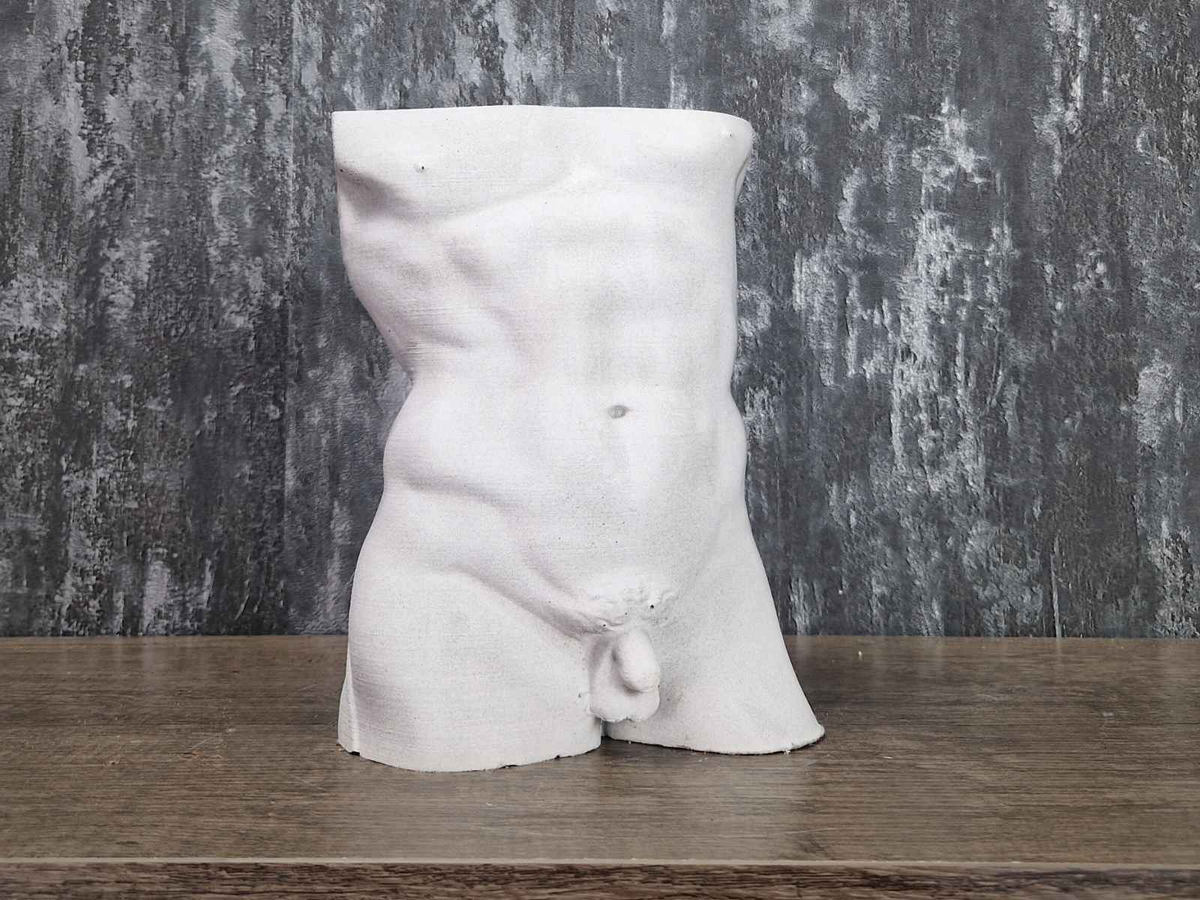 Unplanted Greek god male torso planter shown front-on against a grey backdrop