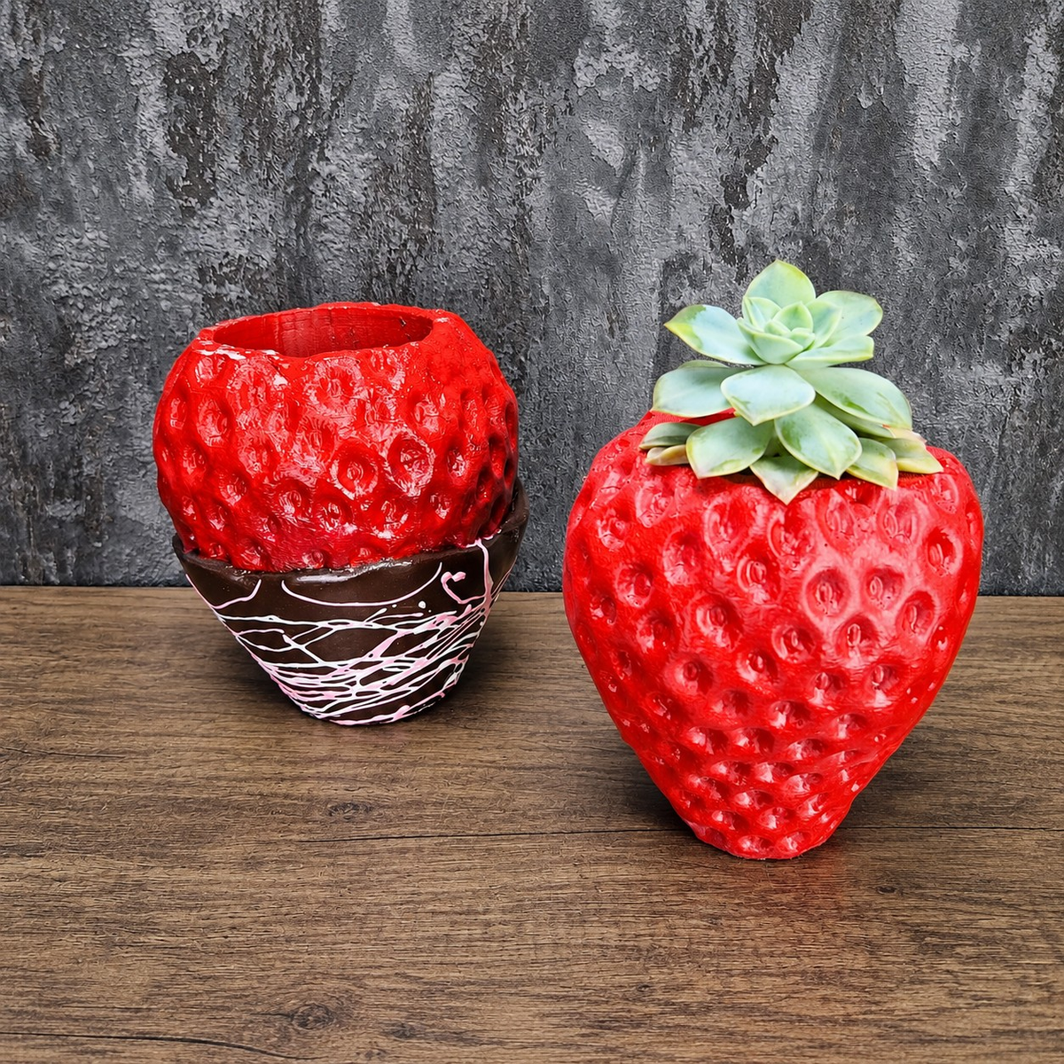 Red and chocolate-dipped strawberry planters displayed together