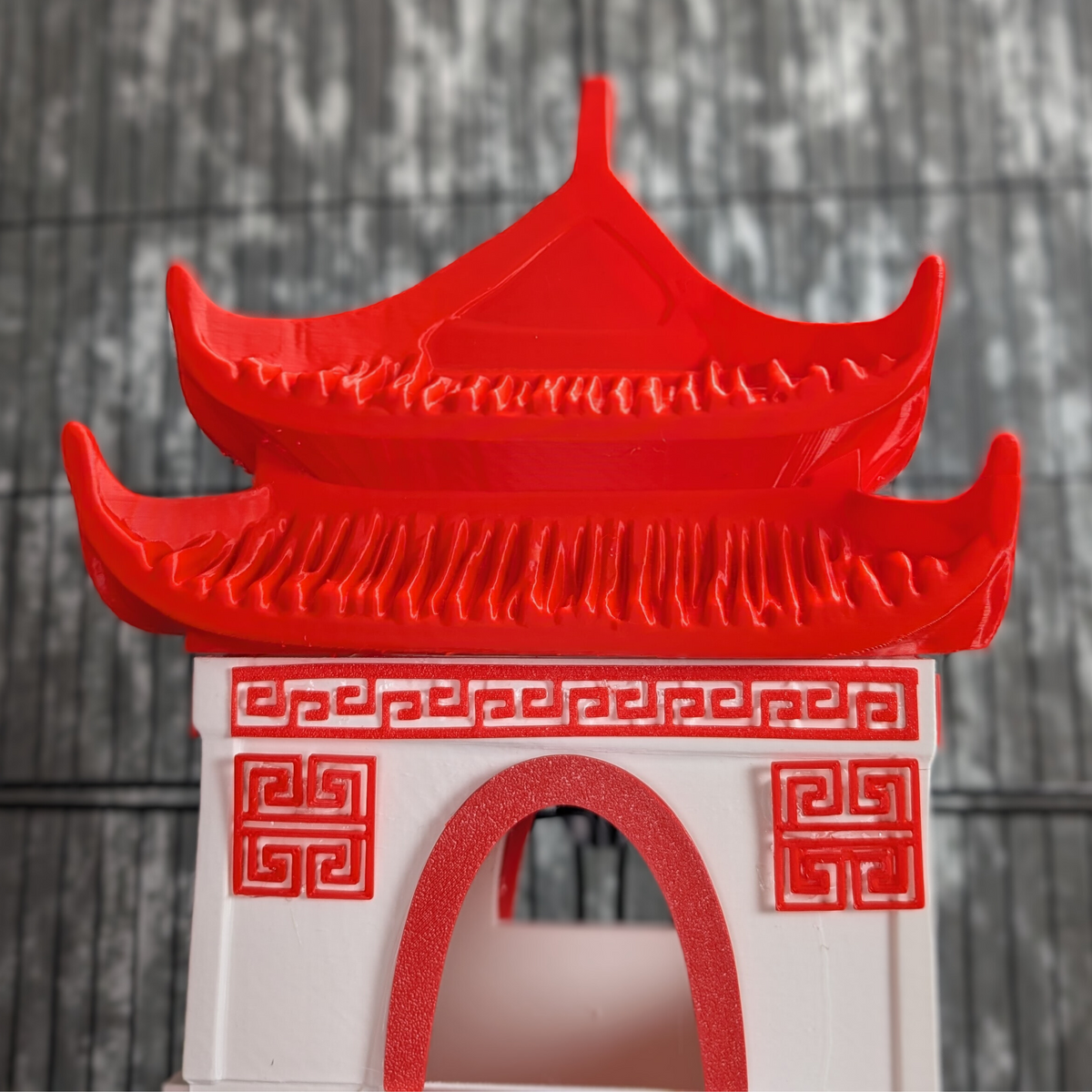 Chinese Temple Rat Hide: close-up of the curved red roof and doorway