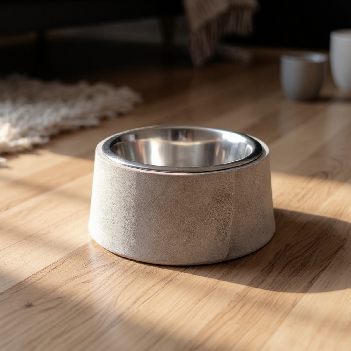 Heavy cast stone dog and cat bowl in a sunlit home setting