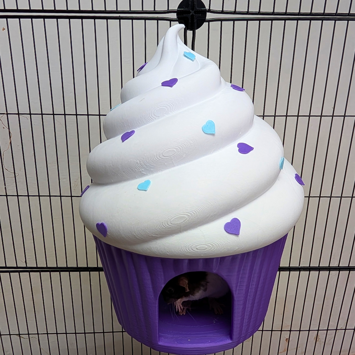 Mounted purple cupcake rat hide with a rat peeking from the entrance