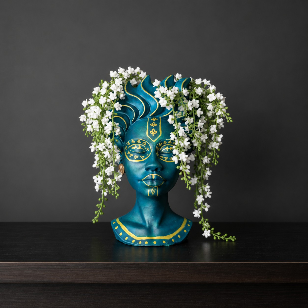 Teal face plant pot with gold wave crown