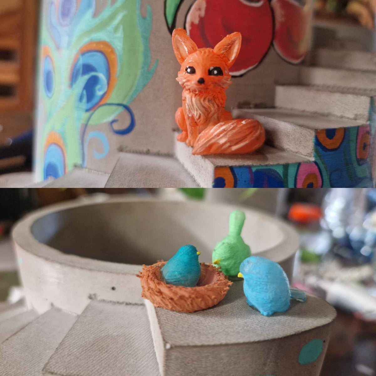 Miniature orange cat and colourful ornaments displayed on the planter steps