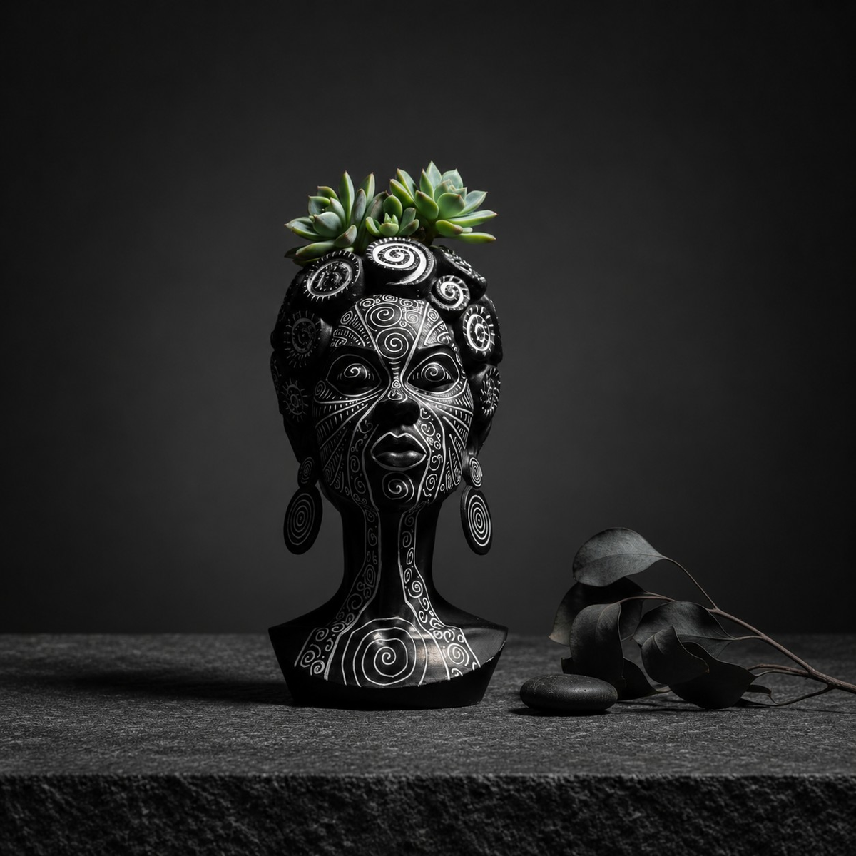 Spiral head planter with succulent and dried botanicals