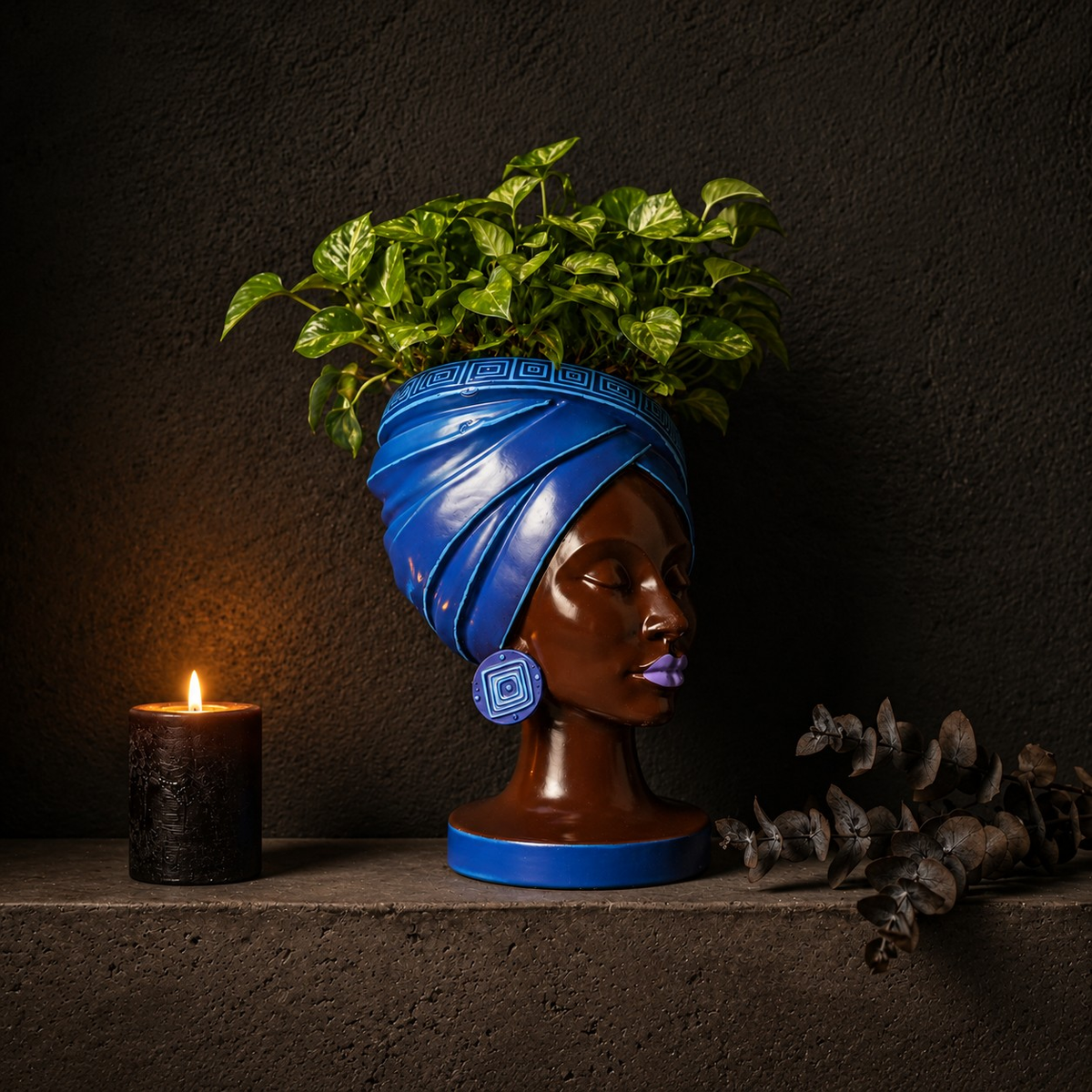 Adire Night black and gold head planter with houseplant