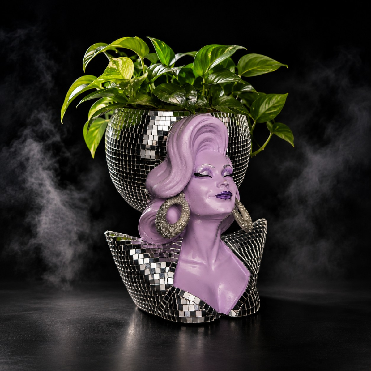 Mother Mirrorball drag queen planter styled with a green trailing plant