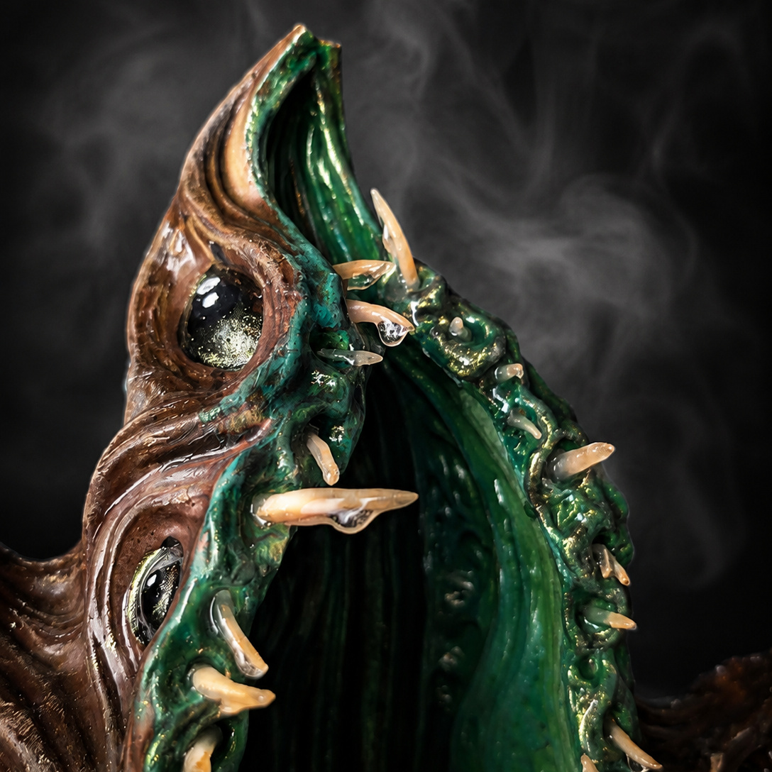 Close view into The Watching Maw green planting cavity and sculpted teeth