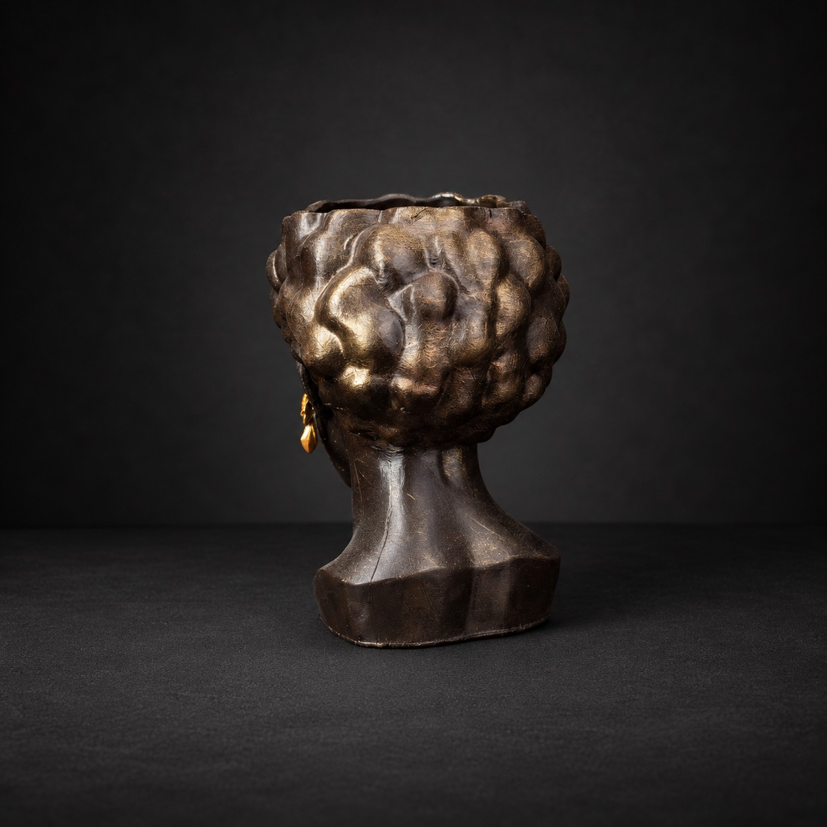 Cast stone head planter rear view showing sculpted hair detail