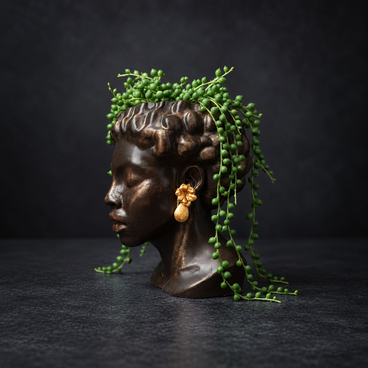 Bust planter with string of pearls trailing from the top