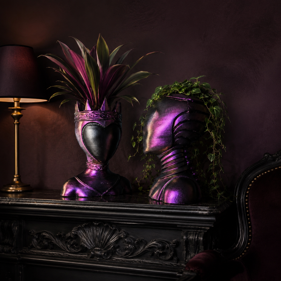 Queen and Oracle Planters, pair of purple bust planters topped with green foliage