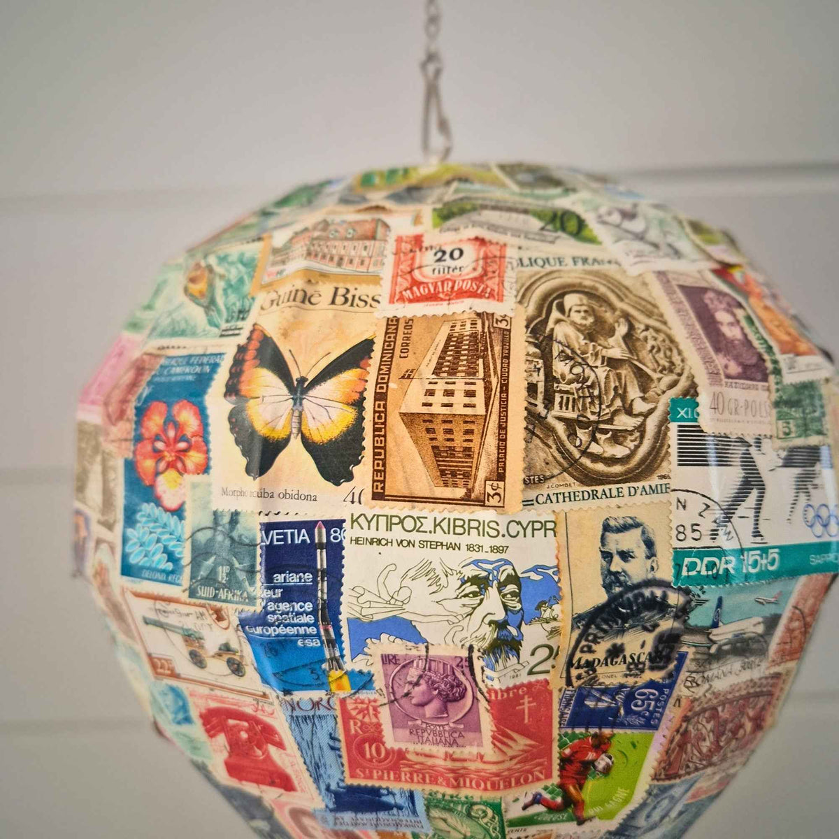 Close-up of vintage stamp artwork on Safari Balloon Planter