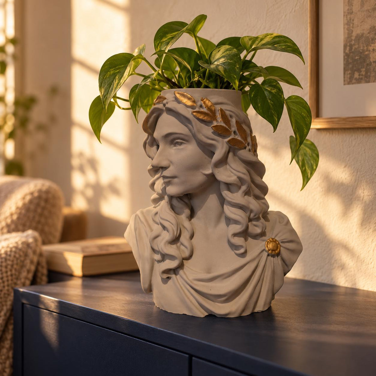 Custom portrait head planter displayed with greenery in a warm home interior