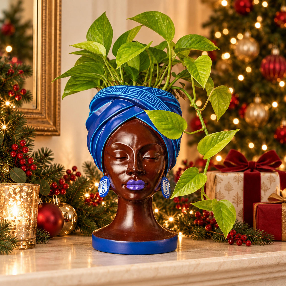 Adire Night cast stone head planter with trailing green plant by Ripleys Nest