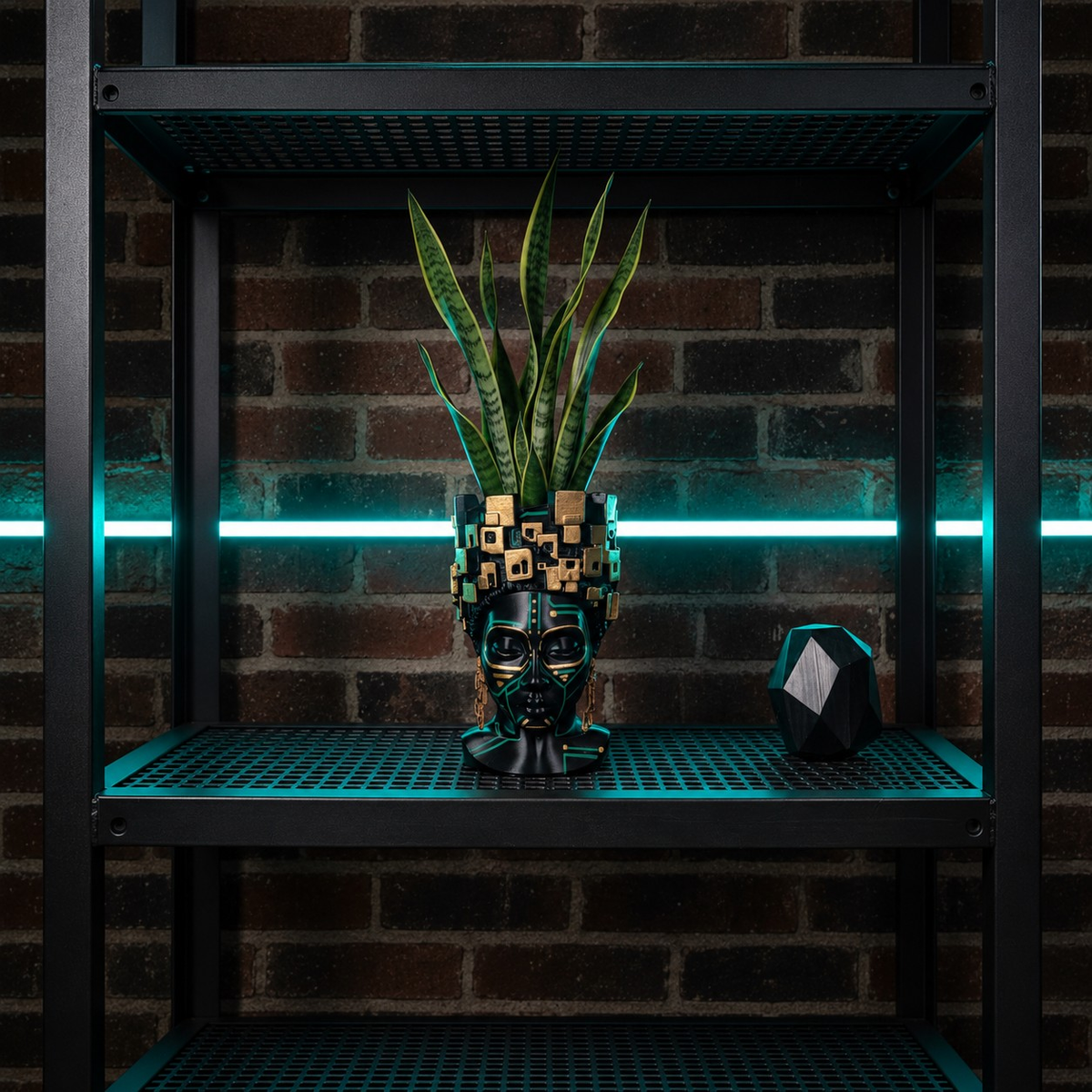 The Motherboard head planter with a snake plant on an industrial shelf