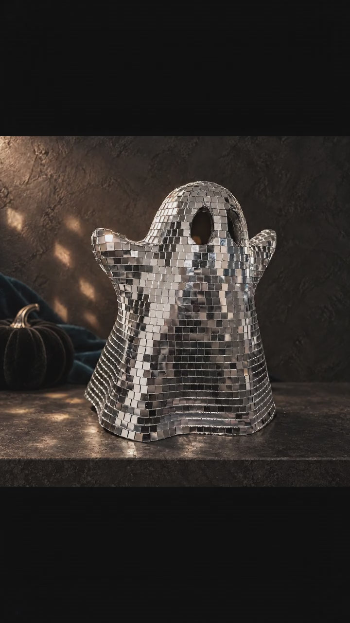 Mirror-tiled ghost ornament without a bow, with moving light reflections.