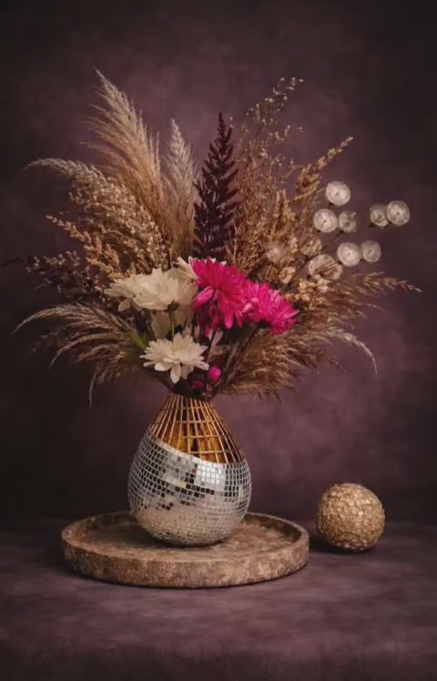 The Disco Drop mirror mosaic vase rotating showcase