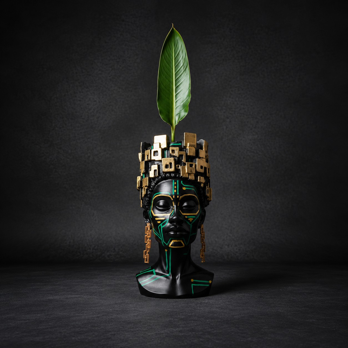Front view of The Motherboard head planter holding a bird of paradise leaf