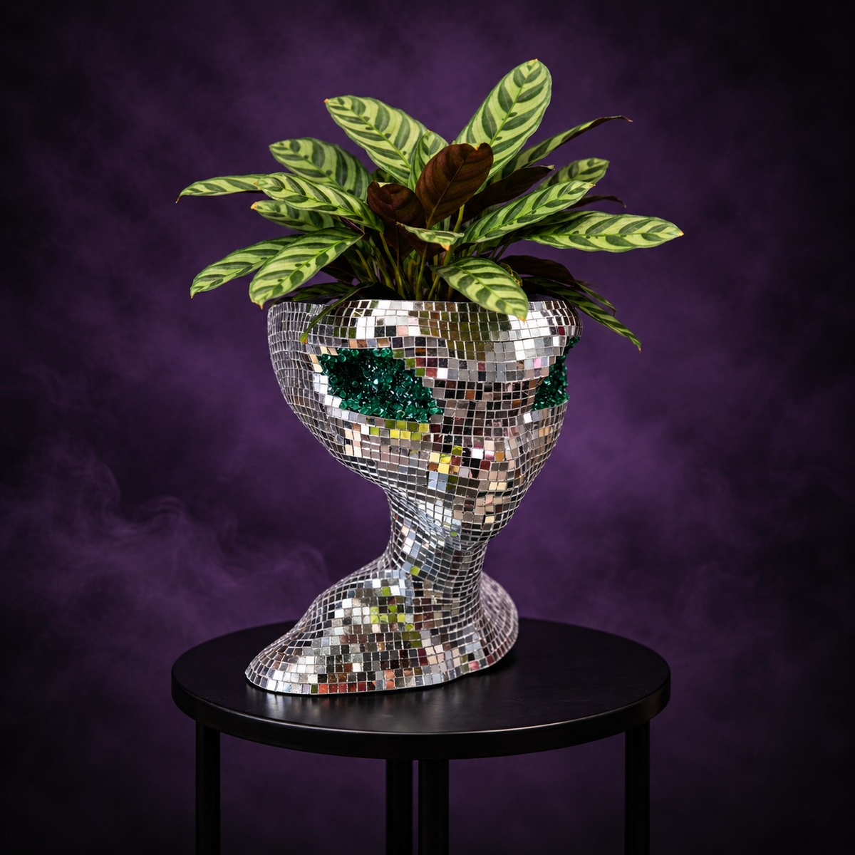 Mirror ball alien planter styled with plants in home setting