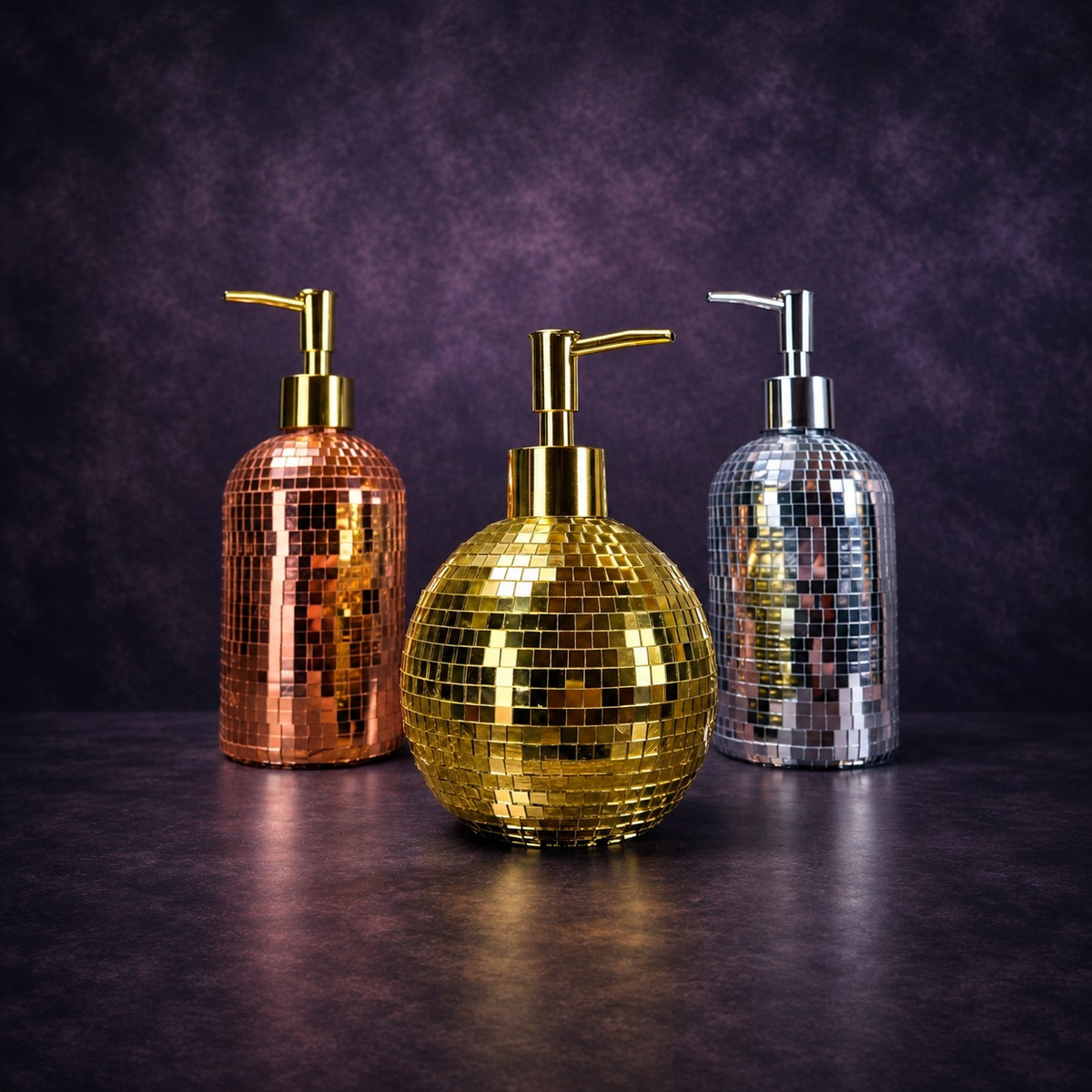 The Lather Ball mirror ball soap dispenser in gold on dark background