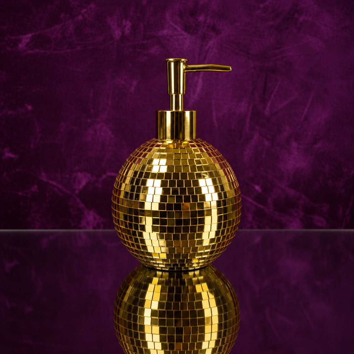Spherical gold mirror mosaic soap dispenser close-up